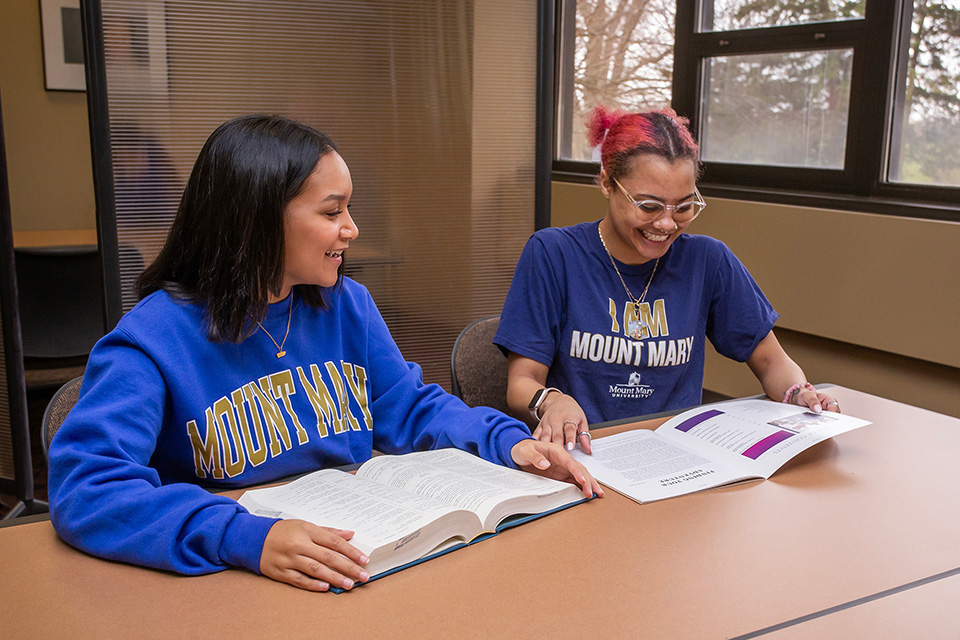 Friends Looking at Phone Together
