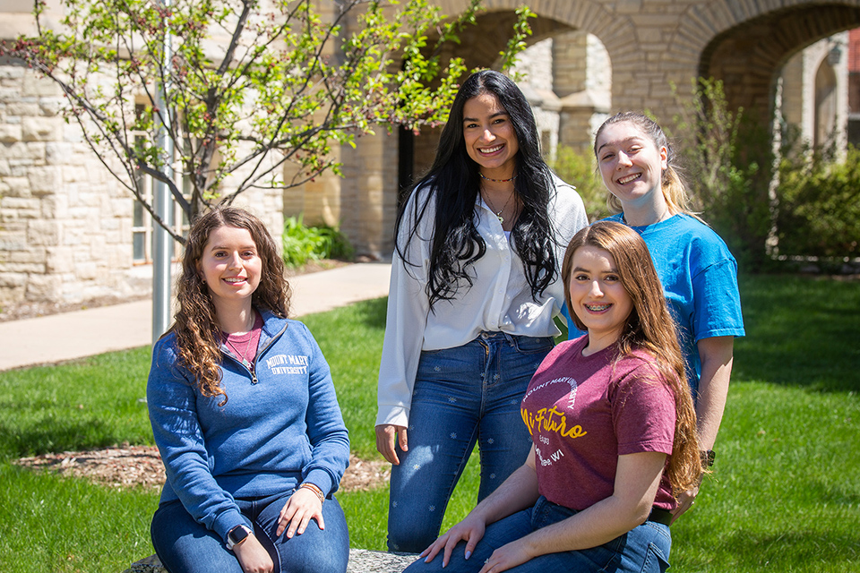 students sitting outside