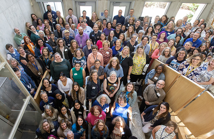 Students looking at a phone together