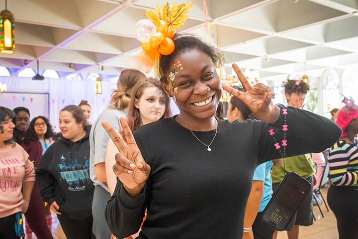 Students looking at a phone together