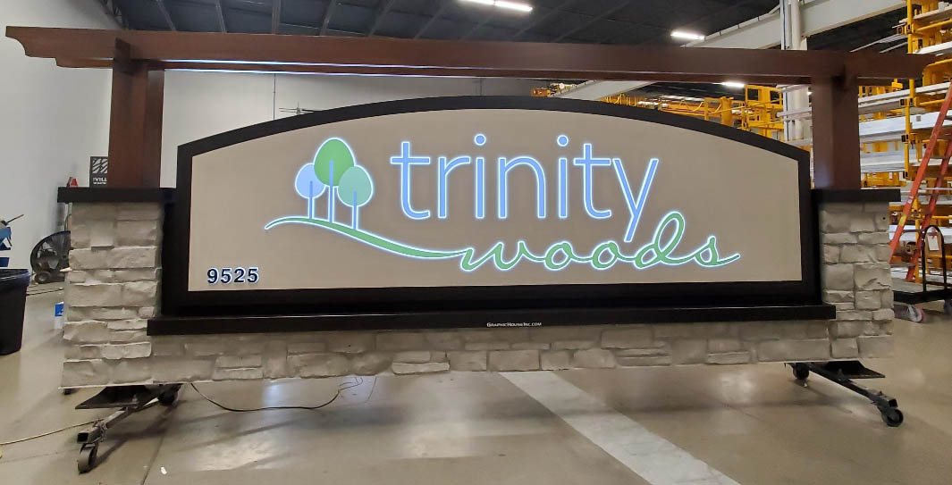 Four Mount Mary Students Looking at a Phone