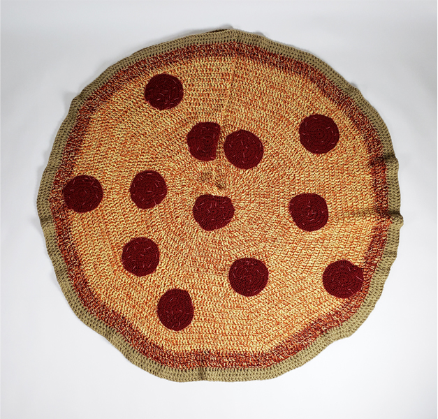 Pizza Afghan - 2017 - 65inD Yarn . . . This work explores our love for food – and how we wrap our bodies in it and the comfort that food brings. Folds into a slice! 
