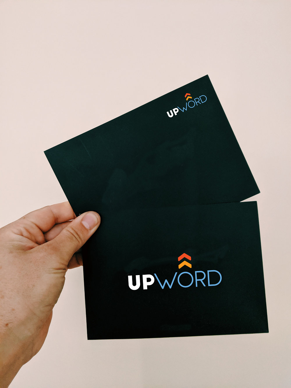 UPWORD is a logo created for an online editor. 